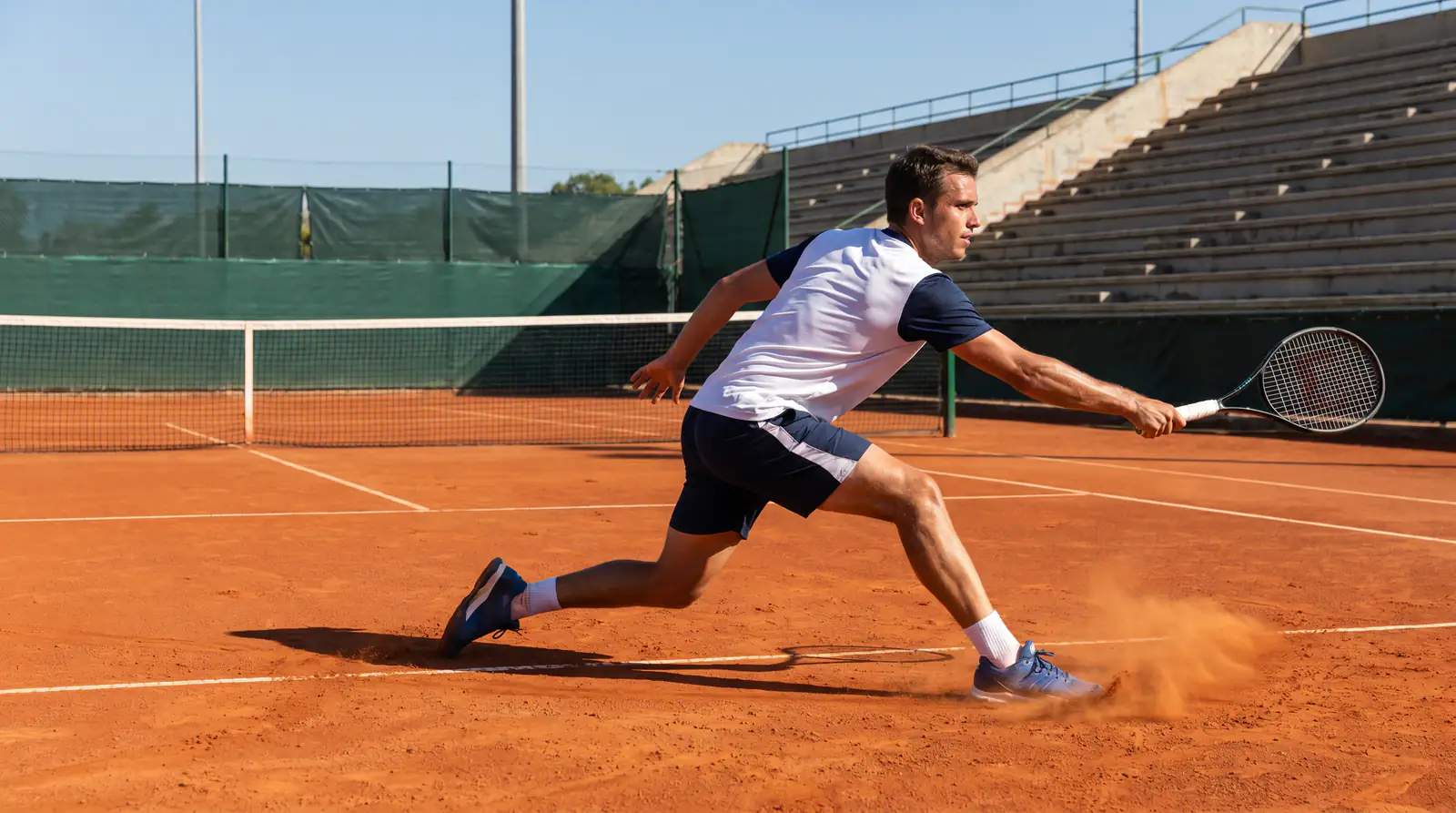 Tennis player returning serve on clay court highlighting surface-based mispricing opportunities